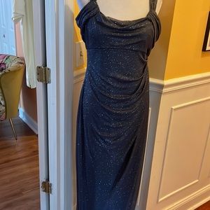 Beautiful floor length gown. Double straps, side slit, and back zipper.